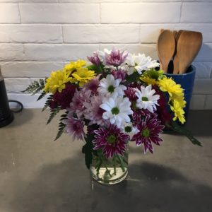 colourful mums in vase